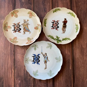 Set of 3 antique Haviland & Co. Limoges porcelain plates with medieval figures and monogram, Antique French china