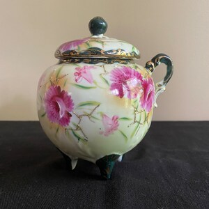 Vintage 3 footed porcelain pot with lid, handle & hand painted floral design