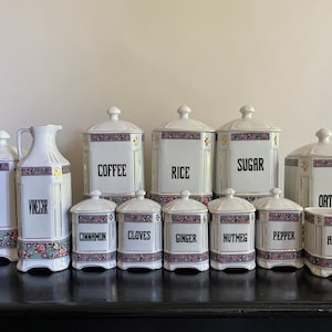 12 piece Vintage kitchen canister set made in Czechoslovakia, white porcelain canisters with floral band design & gold accents