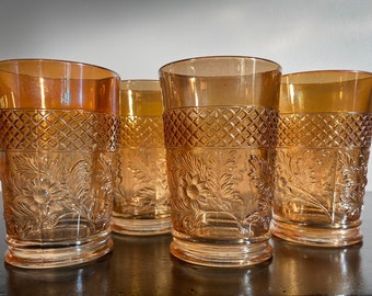 Set of four antique Dugan "Lattice and Daisy" marigold carnival glass tumblers