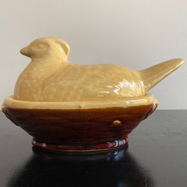 Vintage yellow and brown pottery hen on nest marked PV