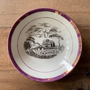 Small antique bowl with pink luster trim and pastoral transferware scene