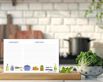 May include: A white recipe card with blue lines and the words "Ingredients" and "Directions" printed at the top. The card is decorated with colorful illustrations of kitchen tools and ingredients, including a bottle of oil, a grater, a whisk, a pot, an oven mitt, a jar of spices, a knife, and a bottle of wine.