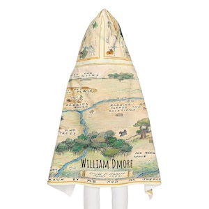 May include: A vintage-style map of the Hundred Acre Wood from Winnie the Pooh, featuring hand-drawn illustrations of the characters' homes and locations. The map is titled "William DMore" and signed by Ernest H. Shepard, March 1959.