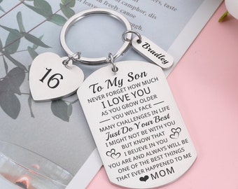 May include: Silver keychain with a heart charm that says "16" and a tag that says "To My Son Never Forget How Much I Love You As You Grow Older You Will Face Many Challenges In Life Just Do Your Best I Might Not Be With You But Know That I Believe In You You Are And Always Will Be One Of The Best Things That Ever Happened To Me Mom" with the name "Bradley" on a smaller tag.