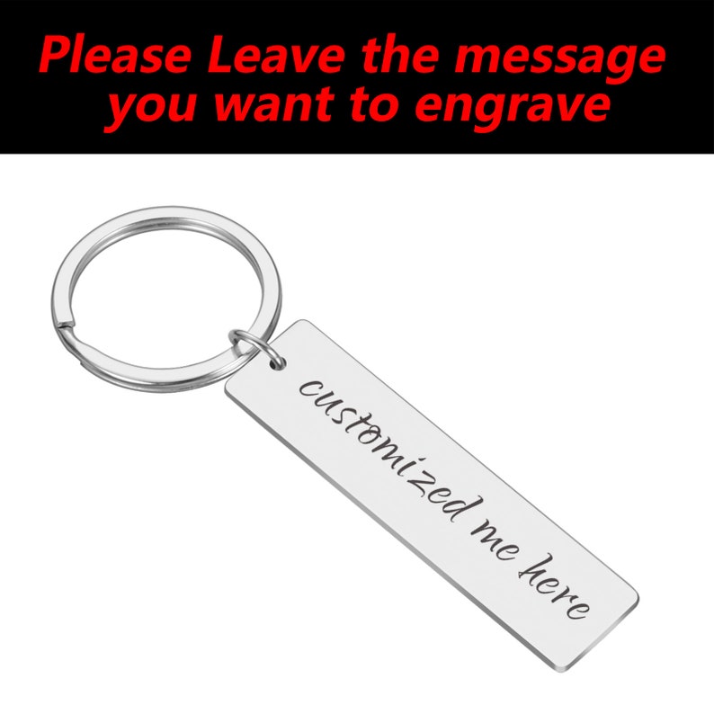 May include: Silver keyring with a rectangular tag that says "customized me here" in cursive.