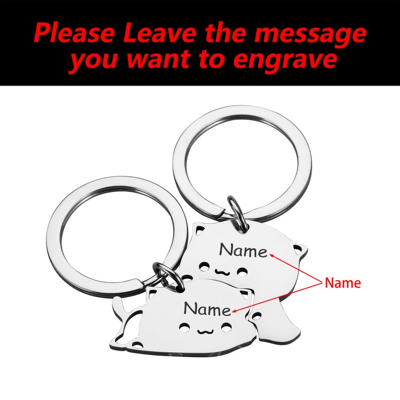 May include: Two silver keychains with cat-shaped charms. Each charm has a space for engraving a name. The text "Please Leave the message you want to engrave" is visible at the top of the image.
