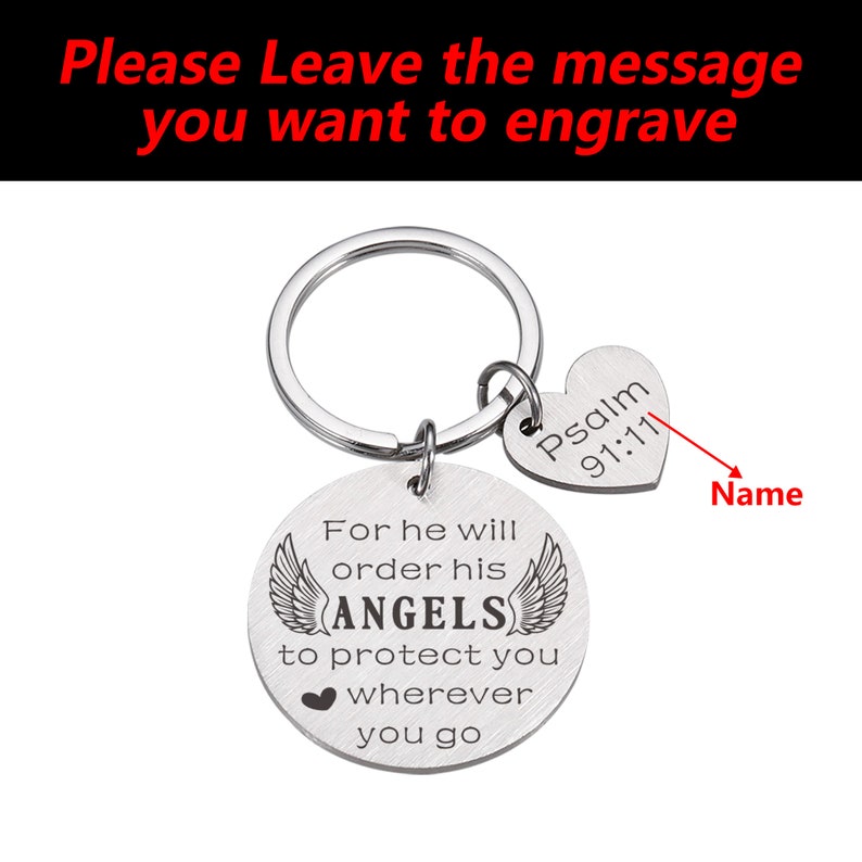 May include: Silver keychain with a round charm that reads "For he will order his ANGELS to protect you wherever you go" with angel wings on either side. A smaller heart-shaped charm reads "Psalm 91:11" and there is a space for a name to be engraved.
