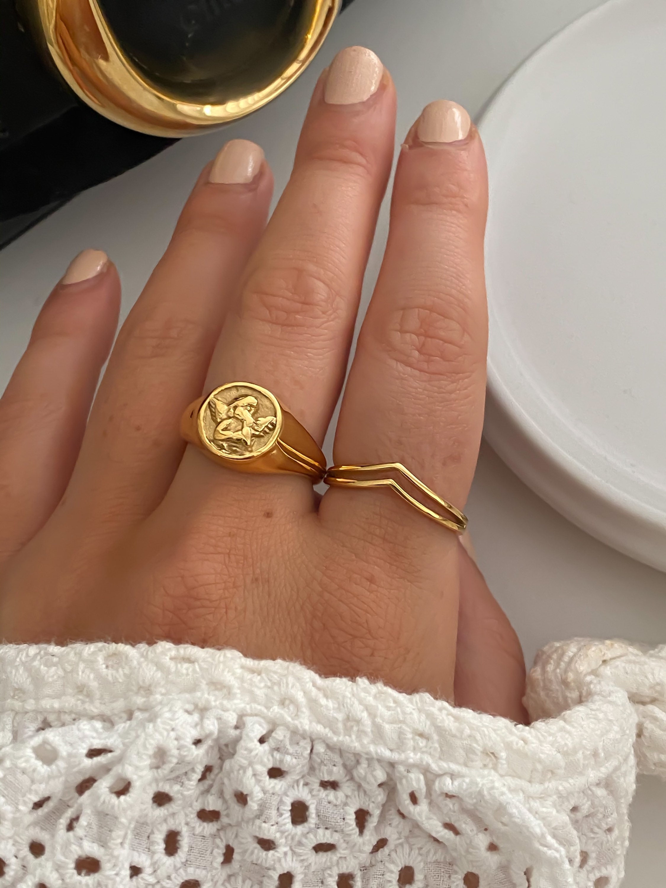 Angel signet best sale ring