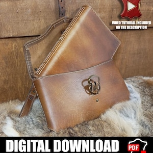 May include: A tan leather journal with a wrap-around cover and a brass-toned metal ring clasp. The journal features visible stitching along the spine and a strap closure. Text on the image reads: VIDEO TUTORIAL INCLUDED ON THE DESCRIPTION.