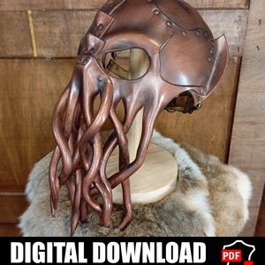 May include: A brown leather mask featuring a cephalopod-inspired design with multiple long, curved tentacles extending from the front. The mask includes visible stitching, metal rivets, and adjustable straps, presented as a digital download pattern.