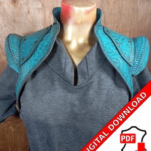 May include: Teal leather shoulder armor with decorative stitching and metal accents. Digital download PDF.