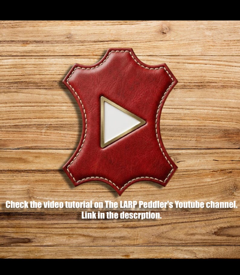 May include: A red leather hide-shaped patch featuring a central white triangle with a gold border. The text reads: Check the video tutorial on The LARP Peddler's Youtube channel. Link in the descrption.