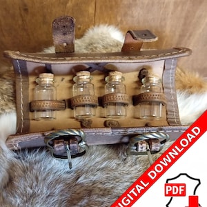 May include: A brown leather pouch with four small glass bottles, each secured with a leather strap and cork stopper. The pouch has a buckle closure and a handle. The background is a mix of fur and wood.