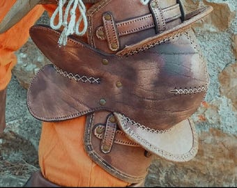 May include: Close-up of brown leather armor with intricate stitching and metal rivets. The armor features straps and ties, suggesting a historical or fantasy theme. The image includes the text "DIGITAL DOWNLOAD" and "PATTERN & INSTRUCTIONS INCLUDED."