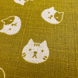 Cat face yellow dobby cotton fabric made in Japan