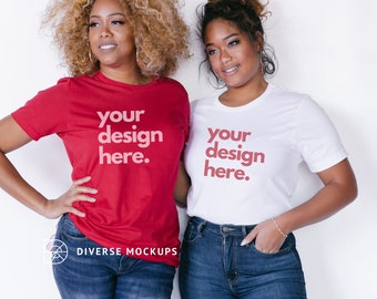 May include: Two women wearing t-shirts with the text "your design here." The woman on the left is wearing a red t-shirt and the woman on the right is wearing a white t-shirt.