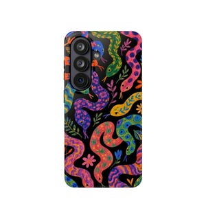 May include: A black smartphone case featuring a vibrant, repeating pattern of colourful snakes in shades of pink, purple, orange, green, and blue, interspersed with small floral and leaf motifs across the entire surface of the device cover.