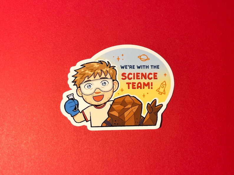 K&ouml;nnte beinhalten: Ein Aufkleber mit einer Cartoon-Figur mit braunen Haaren, die eine Schutzbrille und einen blauen Handschuh tr&auml;gt und ein Reagenzglas h&auml;lt. Daneben befindet sich ein braunes Felswesen. Der Text lautet WE'RE WITH THE SCIENCE TEAM! mit Raketensymbol.