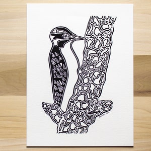 May include: Black and white line art illustration of a woodpecker perched on a tree trunk. The woodpecker's body is covered in a pattern of triangles. The tree trunk is textured with a pattern of circles and lines. The image is signed "remarkable, 2012".