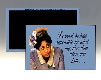 May include: A blue and white magnet with a picture of a woman with a surprised expression. The text on the magnet reads "I cannot be held responsible for what my face does when you talk..."