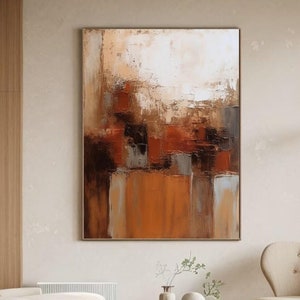 Op de afbeelding: Abstract schilderij met bruine, oranje en witte kleuren. Het schilderij is in moderne stijl en heeft een textuur.