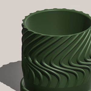 May include: A dark green ceramic planter with a wavy, textured design. The planter has a matching saucer.