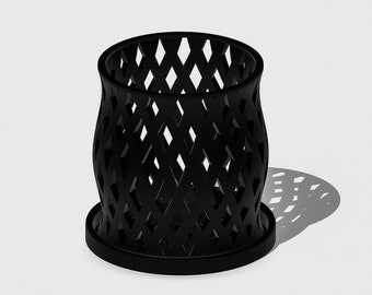 May include: Black planter with a diamond-shaped lattice design. The planter has a wide base and a narrow top.