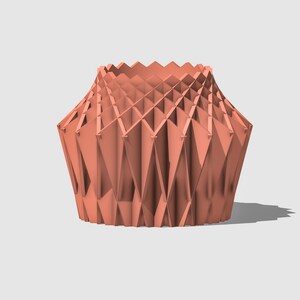 May include: A coral-coloured geometric vase with a unique folded design. The vase is made of a smooth, textured material and has a wide opening at the top.