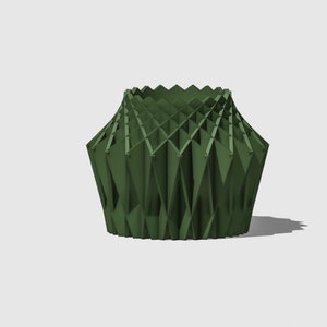 May include: A green geometric vase with a unique, folded design. The vase is made of a rigid material and has a wide opening at the top.