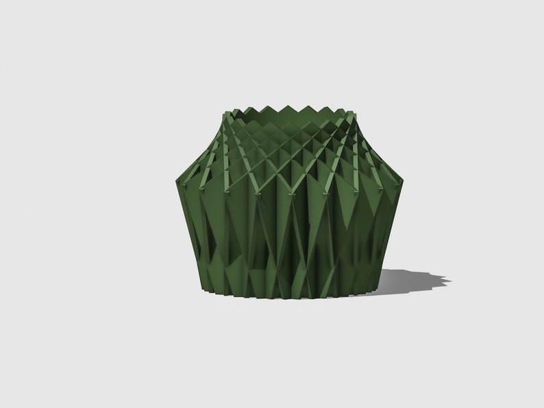 May include: A green geometric vase with a unique, folded design. The vase is made of a rigid material and has a wide opening at the top.