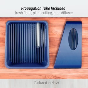 May include: A navy blue propagation station with a rectangular tray and a separate angled piece, both with a modern design. A clear propagation tube is included. Text reads: Propagation Tube Included, fresh floral, plant cutting, reed diffuser. The text "Pictured in Navy" is also visible.