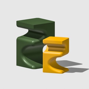 May include: Two abstract, modern, sculptural stools. The larger stool is green and the smaller stool is yellow.