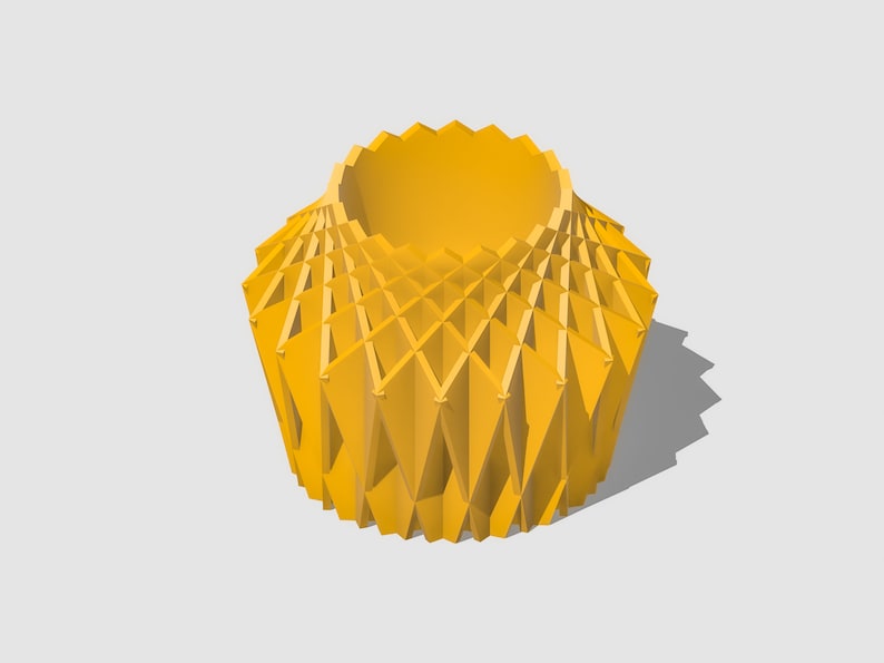 May include: A yellow geometric vase with a unique, intricate design. The vase is made of a series of overlapping triangles that create a three-dimensional effect.