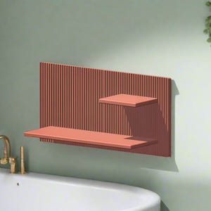 May include: A salmon-colored wall mounted shelf with two shelves. The shelf has a vertical slatted design. The shelf is mounted on a light green wall.