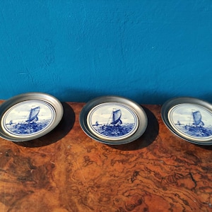 Set of three Delft Blue and metal coasters