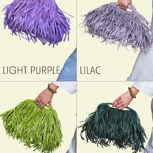 May include: Four fringed handbags in light purple, lilac, kiwi, and green. The bags are displayed, each held by a person. The text labels each bag's colour. The bags have a unique fringed design.