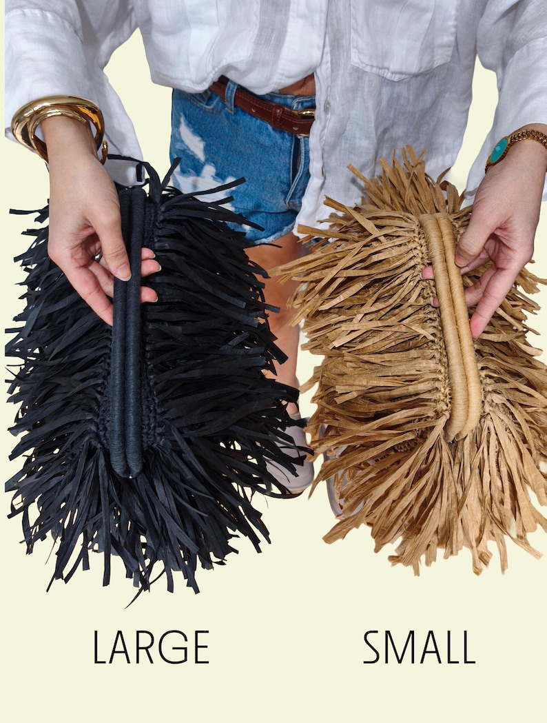 May include: Two fringed handbags, one black and one tan, are displayed. The black bag is labelled "LARGE" and the tan bag is labelled "SMALL". Both bags have a woven handle and a fringe design.