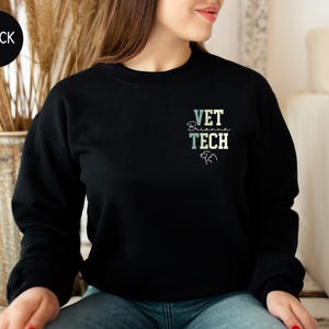 May include: Black sweatshirt with the text "VET Brianna TECH" in a colorful gradient on the front.