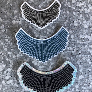 May include: Three black and white stickers with a scalloped design and the text "This is my dissenting collar... It looks fitting for dissents". The stickers are on a gray textured background.