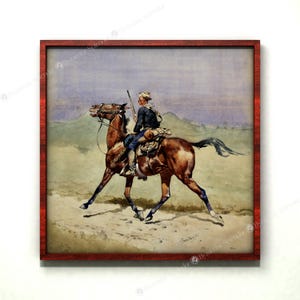 May include: A watercolor painting of a man on horseback riding through a desert landscape. The man is wearing a blue uniform and a hat. The horse is brown with white markings. The painting is framed in a red wooden frame.