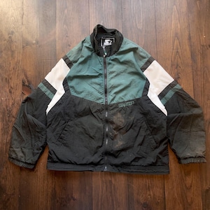 May include: A black and green Starter brand jacket with white accents. The jacket has a zipper closure and a logo on the front that says "Starter".