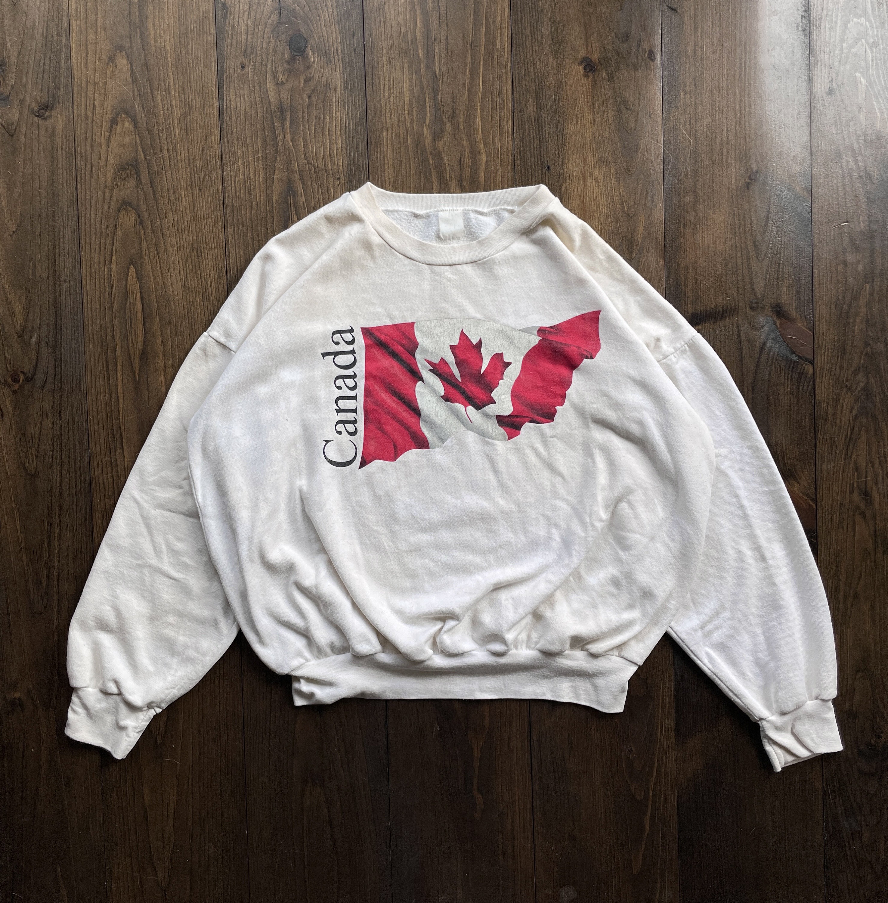PREOWNED Canada hockey jersey size L red, white, black Maple Leaf Logo 1867