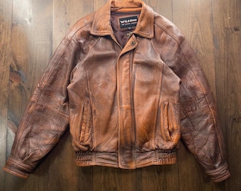 Vintage 1990’s Wilson’s Genuine Leather Bomber Jacket / size Small (oversized, see measurements)