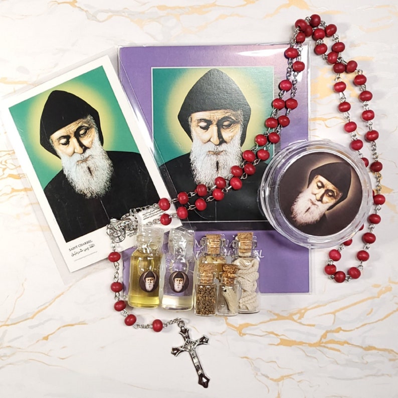 Set of oil, water, incense, soil, relic, rosary and novena booklet of Saint Charbel image 1