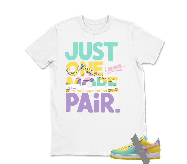 May include: White t-shirt with the text "JUST ONE MORE PAIR" in teal, yellow, purple, and pink. A colorful sneaker is shown at the bottom right. The sneaker is yellow, green, purple, and pink.