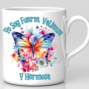 May include: White ceramic mug with a colorful butterfly and floral design. The text "Yo Soy Fuerte, Valiente y Hermosa" is printed in blue on the mug.