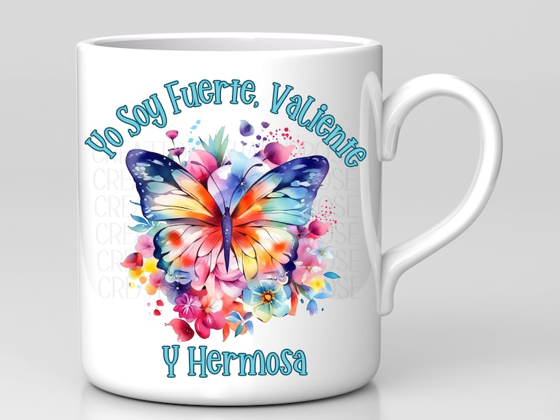 May include: White ceramic mug with a colorful butterfly and floral design. The text "Yo Soy Fuerte, Valiente y Hermosa" is printed in blue on the mug.