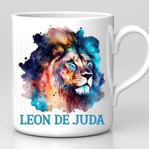 May include: White ceramic mug with a colorful watercolor illustration of a lion's head with the text "LEON DE JUDA" in blue lettering.