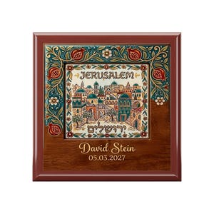 May include: A square wooden plaque featuring a central ceramic tile with a colorful illustration of Jerusalem, including the text "JERUSALEM" and Hebrew script. The tile is framed by pomegranate motifs. Below, the name "David Stein" and "05.03.2027" are printed.
